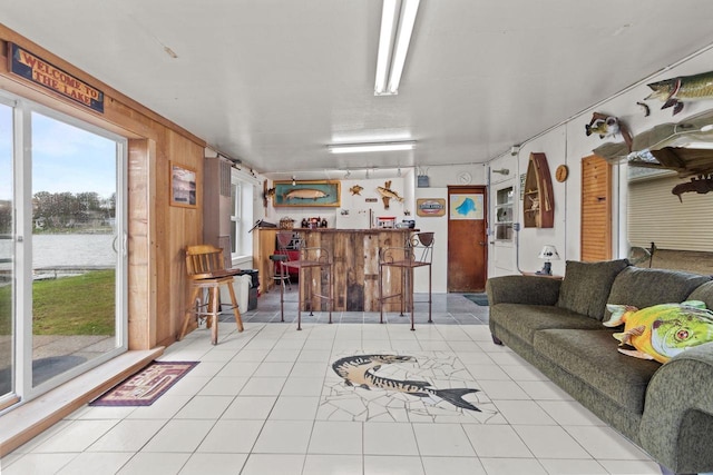 W2138 Melmar Dr, Markesan, WI 53946 - living area with wooden walls, a water view, and tile patterned flooring