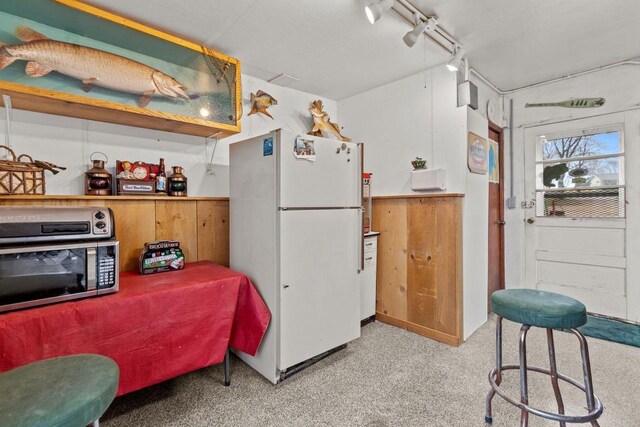 W2138 Melmar Dr, Markesan, WI 53946 - kitchen featuring stainless steel microwave and freestanding refrigerator