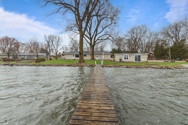 W2138 Melmar Dr, Markesan, WI 53946 - view of dock with a yard and a water view