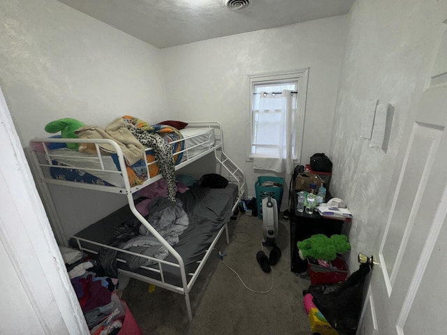 bedroom featuring visible vents