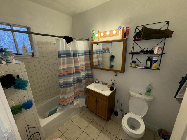 full bathroom with toilet, tile patterned flooring, shower / tub combo, and vanity