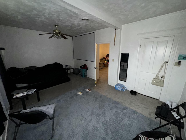 carpeted living area featuring a ceiling fan, visible vents, and a textured ceiling