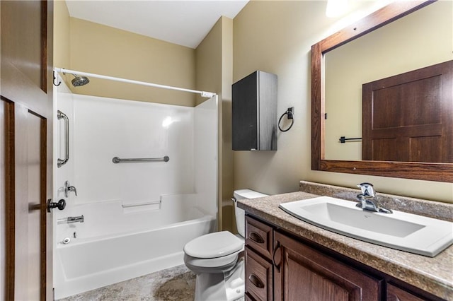 bathroom featuring toilet, vanity, and shower / washtub combination