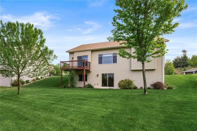 back of house with a yard and a wooden deck