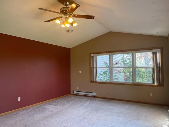 empty room with baseboard heating, light colored carpet, a wealth of natural light, and lofted ceiling