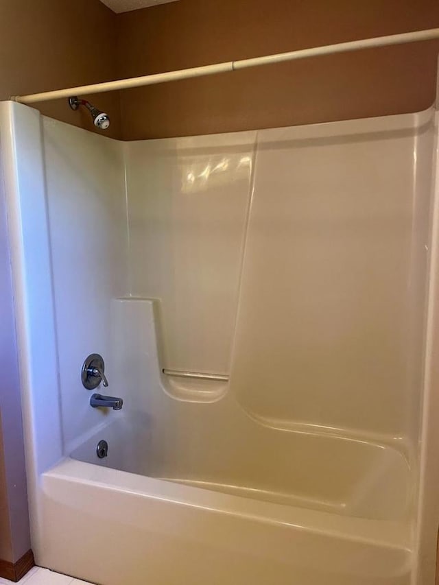 full bath featuring tub / shower combination