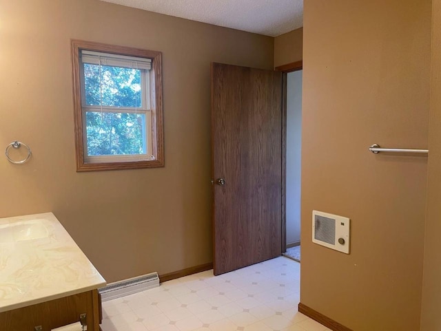 bathroom with tile patterned floors, baseboards, visible vents, and vanity