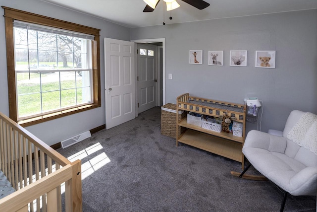 interior space with visible vents and a ceiling fan