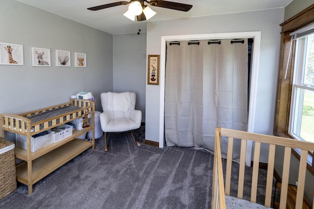 bedroom with ceiling fan, a closet, and carpet flooring