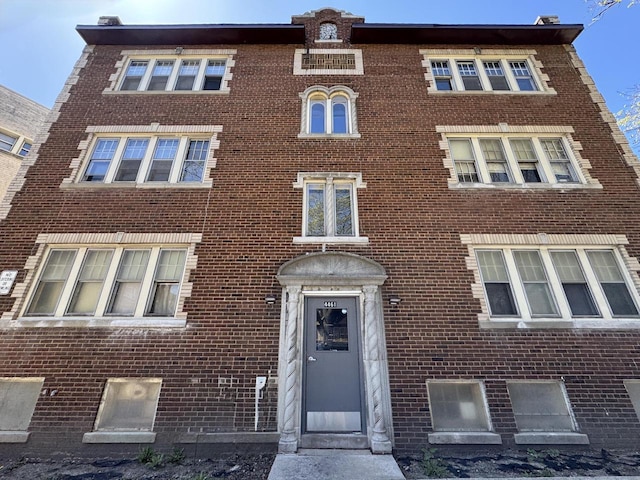 view of front of house with brick siding