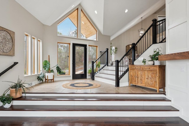 5400 N State Road 83, Hartland, WI 53029 - foyer with recessed lighting, high vaulted ceiling, baseboards, and stairway