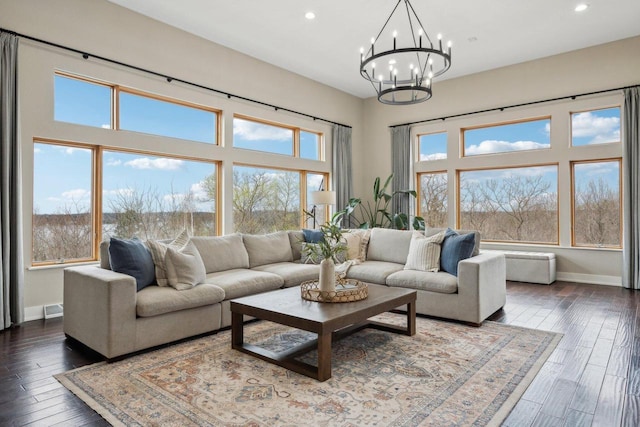 5400 N State Road 83, Hartland, WI 53029 - living area with recessed lighting, baseboards, an inviting chandelier, and plenty of natural light