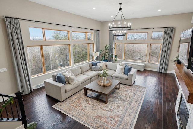 5400 N State Road 83, Hartland, WI 53029 - living area featuring an inviting chandelier, baseboards, a baseboard radiator, and visible vents