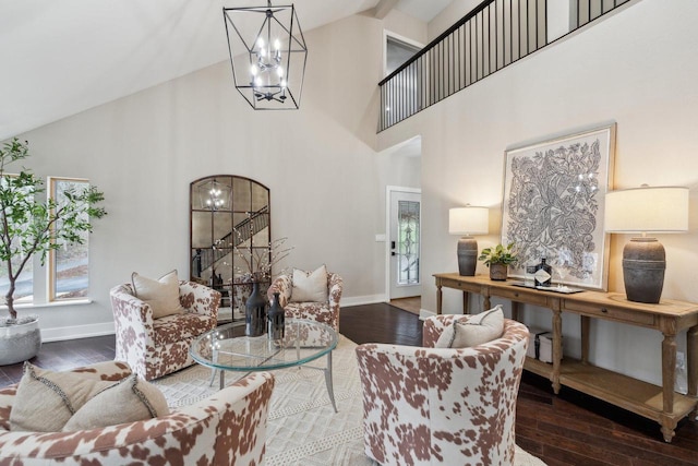 5400 N State Road 83, Hartland, WI 53029 - living room featuring baseboards, a notable chandelier, wood finished floors, and high vaulted ceiling
