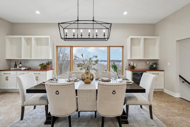 5400 N State Road 83, Hartland, WI 53029 - dining room with recessed lighting, baseboards, wine cooler, and a bar