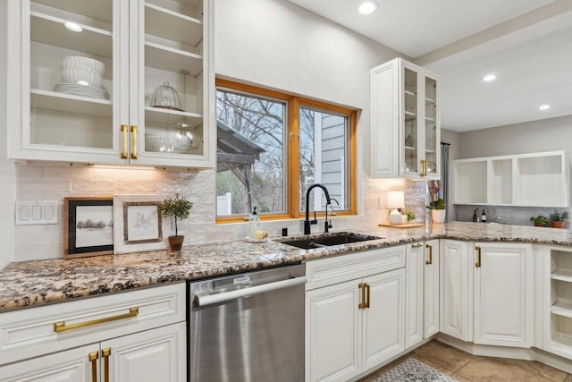 5400 N State Road 83, Hartland, WI 53029 - kitchen featuring light stone counters, decorative backsplash, a sink, and dishwasher