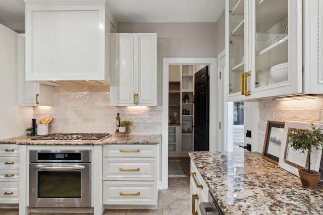 5400 N State Road 83, Hartland, WI 53029 - kitchen featuring light stone counters, white cabinetry, and stainless steel appliances