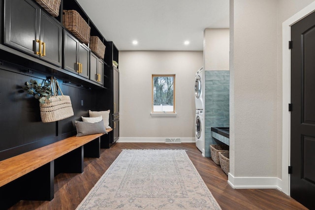 5400 N State Road 83, Hartland, WI 53029 - mudroom with baseboards, stacked washing maching and dryer, dark wood-style floors, and visible vents