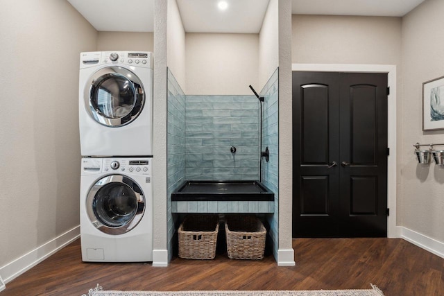 5400 N State Road 83, Hartland, WI 53029 - washroom featuring baseboards, stacked washer / drying machine, wood finished floors, and laundry area
