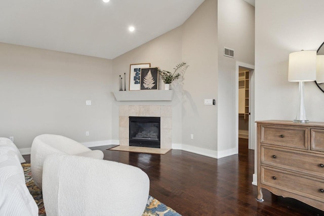 5400 N State Road 83, Hartland, WI 53029 - living room with visible vents, baseboards, dark wood-type flooring, and a fireplace