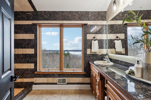5400 N State Road 83, Hartland, WI 53029 - bathroom featuring vanity, a water view, and visible vents