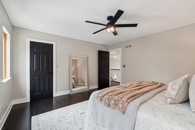 5400 N State Road 83, Hartland, WI 53029 - bedroom with baseboards, a ceiling fan, dark wood-style floors, and visible vents