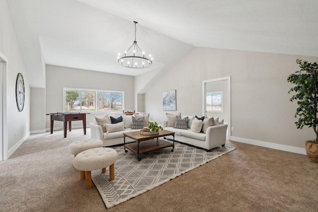 5400 N State Road 83, Hartland, WI 53029 - carpeted living room featuring baseboards, a notable chandelier, and high vaulted ceiling