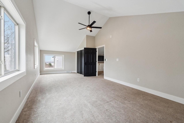 5400 N State Road 83, Hartland, WI 53029 - unfurnished living room featuring carpet flooring, a ceiling fan, and high vaulted ceiling