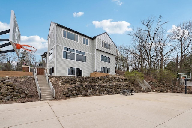 5400 N State Road 83, Hartland, WI 53029 - exterior space with basketball court and stairway