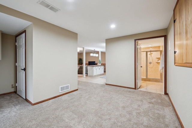 5400 N State Road 83, Hartland, WI 53029 - unfurnished room featuring visible vents, baseboards, and light colored carpet