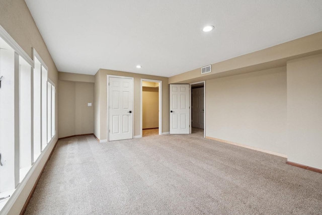 5400 N State Road 83, Hartland, WI 53029 - unfurnished bedroom featuring visible vents, baseboards, and light colored carpet