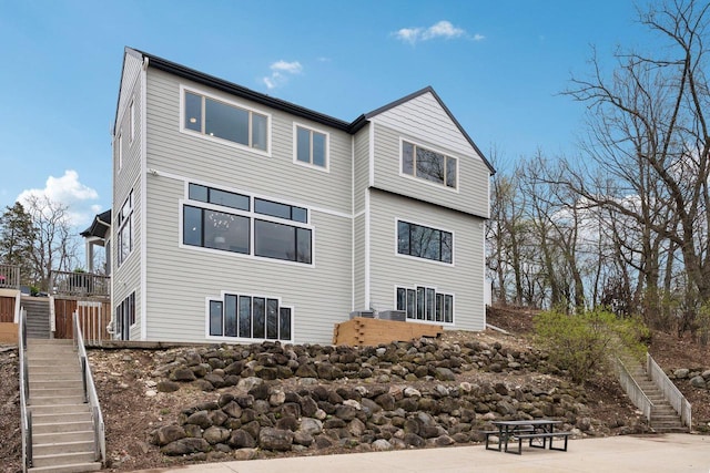5400 N State Road 83, Hartland, WI 53029 - back of house featuring central AC and stairway