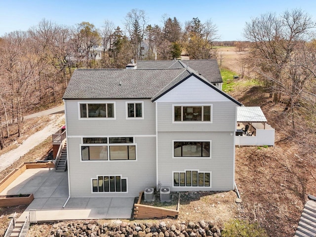 5400 N State Road 83, Hartland, WI 53029 - rear view of house featuring stairs, cooling unit, and a patio area