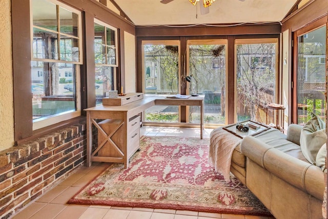 172 N St, Sun Prairie, WI 53590 - sunroom with plenty of natural light, vaulted ceiling, and tile patterned flooring