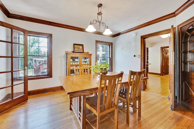 172 N St, Sun Prairie, WI 53590 - dining area featuring ornamental molding, plenty of natural light, light wood-type flooring, and baseboards
