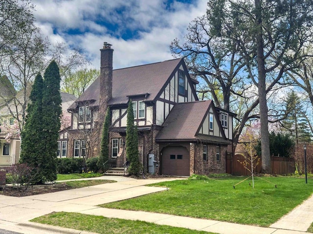 172 N St, Sun Prairie, WI 53590 - view of front of home with brick siding, concrete driveway, a chimney, and an attached garage