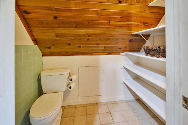 172 N St, Sun Prairie, WI 53590 - half bath with tile patterned flooring, toilet, wood ceiling, and vaulted ceiling