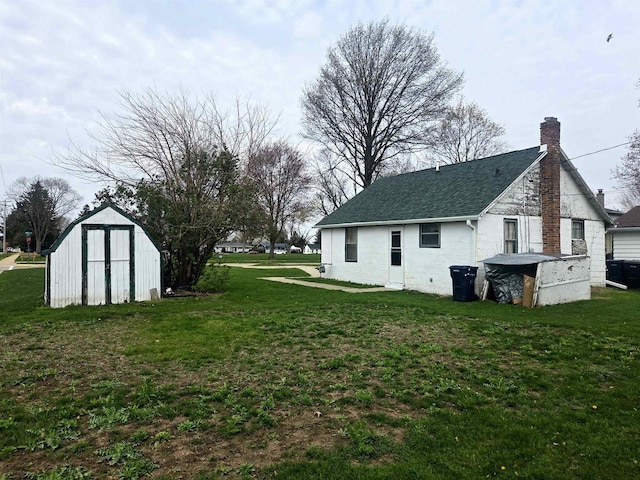 exterior space featuring a storage unit and an outdoor structure
