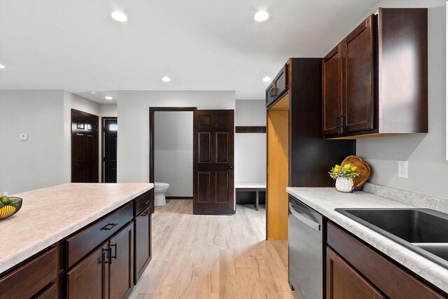 433 Scott St, Ripon, WI 54971 - kitchen featuring stainless steel dishwasher, dark brown cabinets, light wood finished floors, light countertops, and recessed lighting