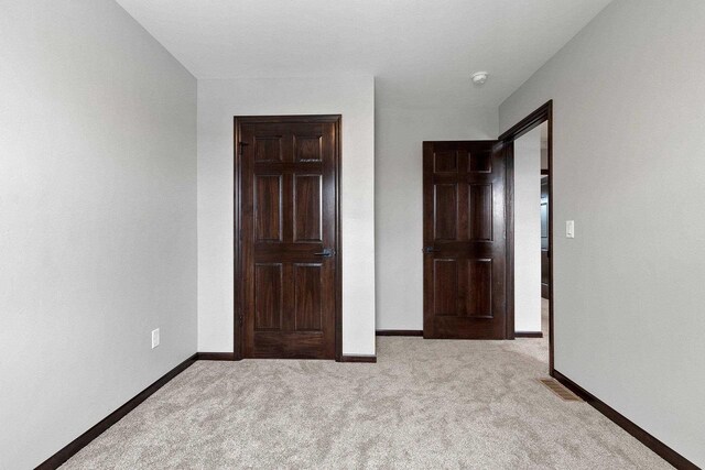 433 Scott St, Ripon, WI 54971 - unfurnished bedroom featuring carpet, visible vents, and baseboards