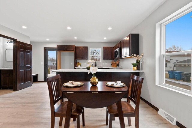 433 Scott St, Ripon, WI 54971 - dining space with recessed lighting, visible vents, light wood finished floors, and baseboards