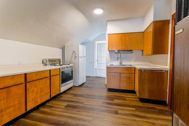 kitchen featuring range with gas stovetop, a sink, light countertops, stainless steel dishwasher, and lofted ceiling