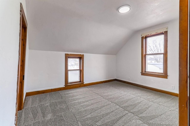bonus room with baseboards, carpet floors, and vaulted ceiling