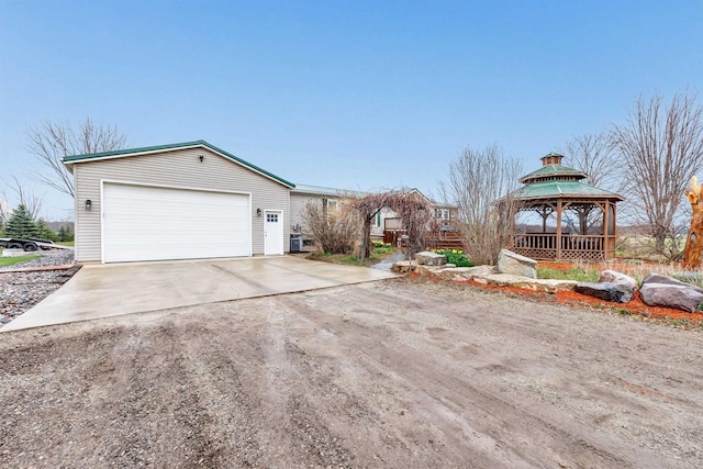 8795 County Rd S, Pulaski, WI 54162 - view of property exterior with an outbuilding, driveway, and a gazebo
