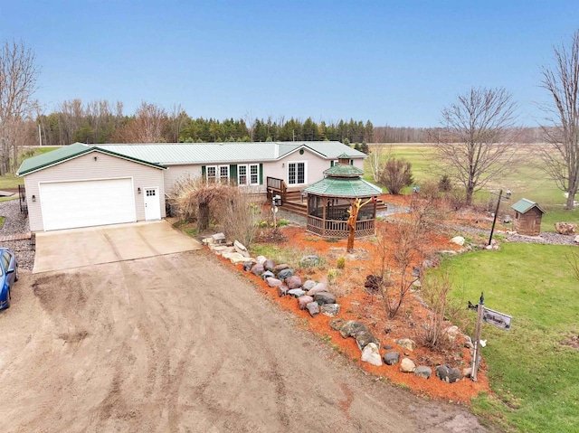 8795 County Rd S, Pulaski, WI 54162 - single story home featuring a gazebo, metal roof, a front lawn, concrete driveway, and an attached garage