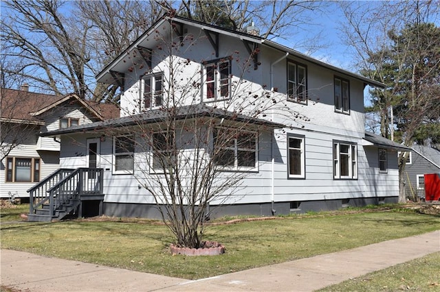 903 Wilson Ave, Rice Lake, WI 54868 - view of home's exterior with stucco siding and a yard