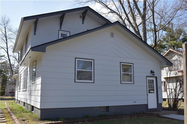 903 Wilson Ave, Rice Lake, WI 54868 - back of house featuring crawl space