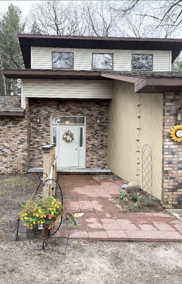 W4609 S Pearl Lake Rd, Redgranite, WI 54970 - doorway to property featuring brick siding