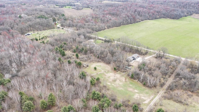 bird's eye view with a wooded view and a rural view