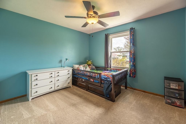 bedroom featuring baseboards, carpet flooring, and ceiling fan